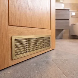 Grille de ventilation double face pour porte 430 x 115 mm / Patine dorée